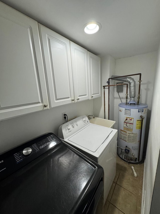 clothes washing area with gas water heater, cabinet space, light tile patterned flooring, a sink, and independent washer and dryer