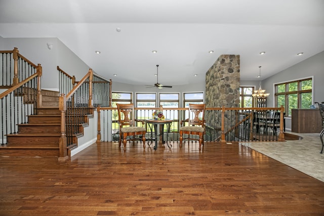 unfurnished dining area with a chandelier, recessed lighting, dark wood-style floors, and lofted ceiling