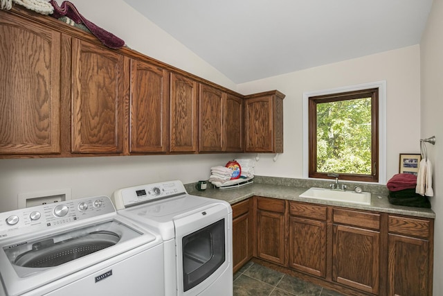 laundry room featuring washer and clothes dryer, a sink, and cabinet space