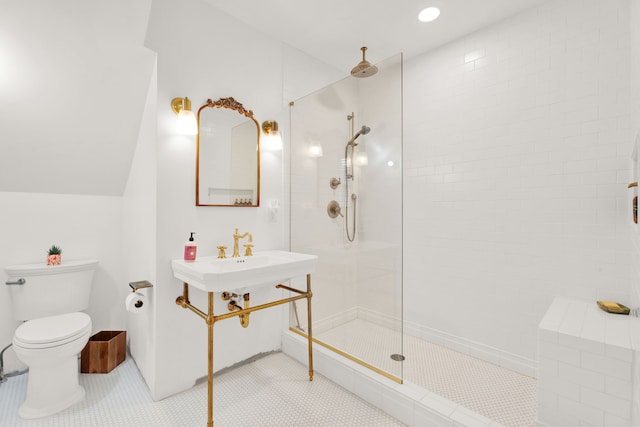 bathroom featuring a walk in shower, tile patterned flooring, toilet, and lofted ceiling