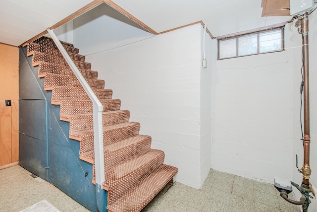 below grade area with stairs and tile patterned floors