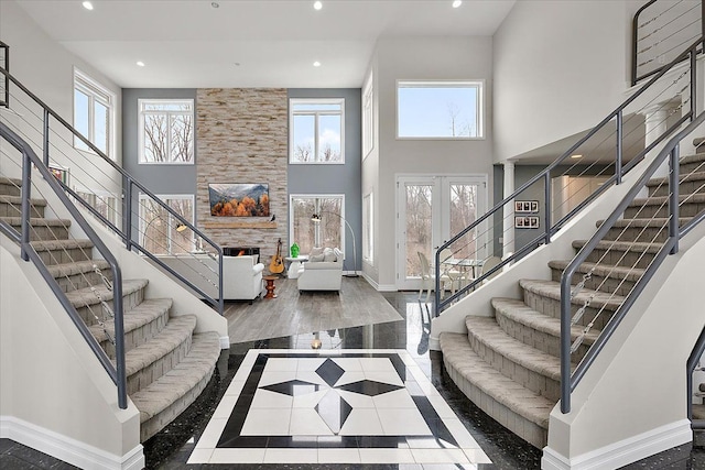 foyer entrance featuring a wealth of natural light, baseboards, and recessed lighting