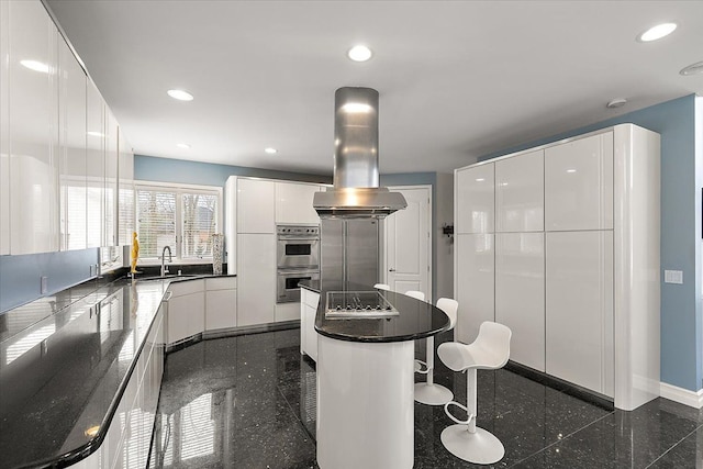 kitchen featuring recessed lighting, island range hood, granite finish floor, modern cabinets, and black electric cooktop