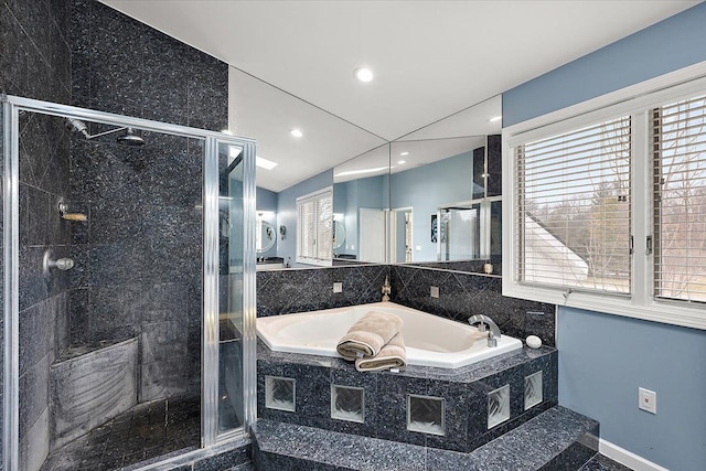 bathroom with recessed lighting, baseboards, a stall shower, and a bath