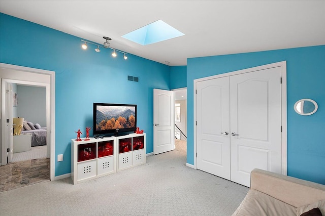 game room with lofted ceiling with skylight, visible vents, baseboards, and carpet floors