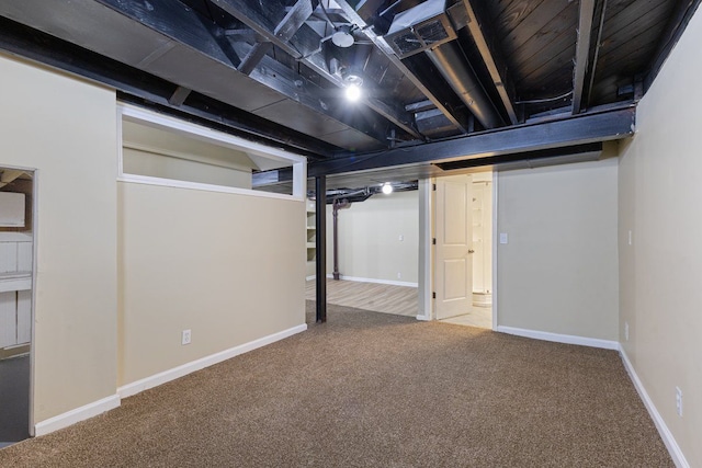 finished basement featuring carpet and baseboards