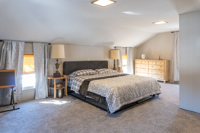 carpeted bedroom with vaulted ceiling