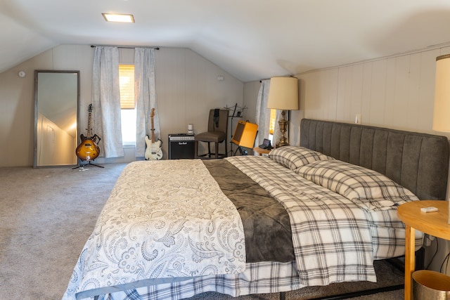 carpeted bedroom with lofted ceiling