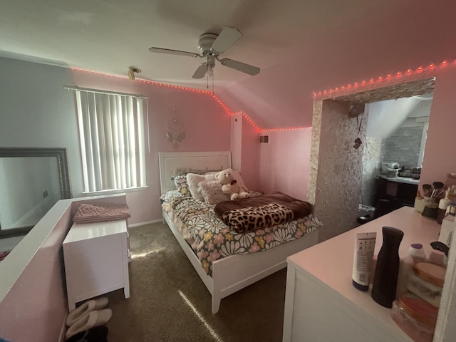 bedroom featuring dark colored carpet, ceiling fan, and lofted ceiling