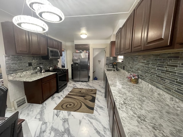 kitchen featuring dark brown cabinetry, a sink, visible vents, marble finish floor, and appliances with stainless steel finishes