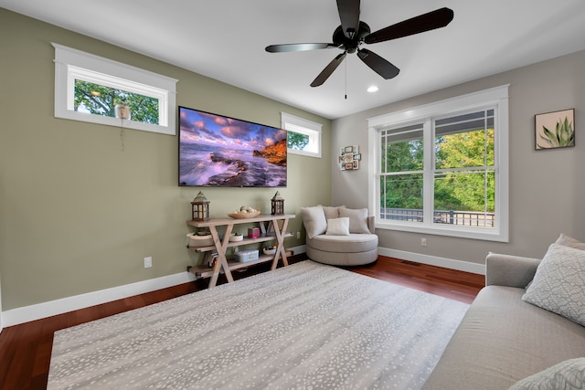 living area with visible vents, baseboards, a ceiling fan, wood finished floors, and recessed lighting