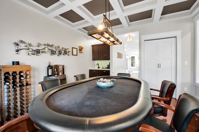 dining area with coffered ceiling and beam ceiling