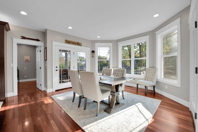 dining area with baseboards, dark wood-style flooring, and recessed lighting