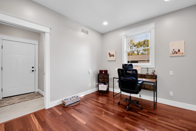 office space featuring recessed lighting, wood finished floors, visible vents, and baseboards