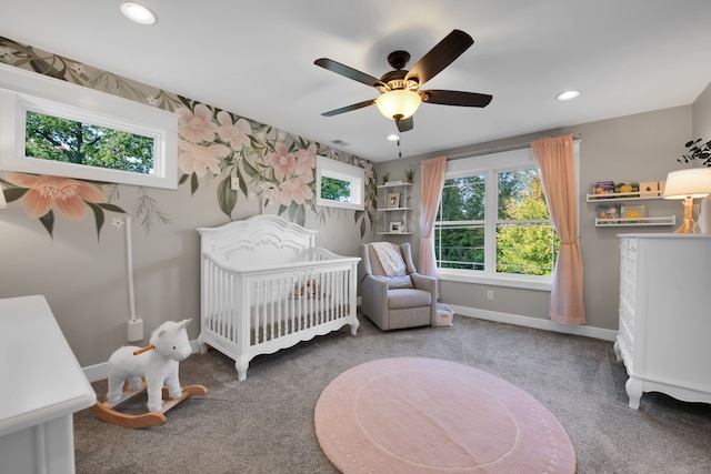 carpeted bedroom with a nursery area, multiple windows, and recessed lighting