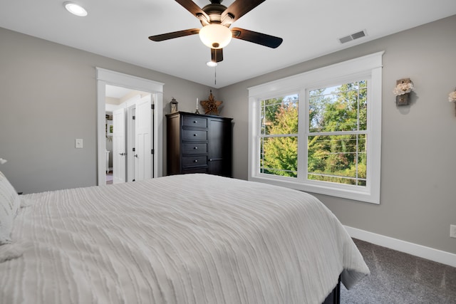 bedroom with a ceiling fan, carpet, visible vents, and baseboards