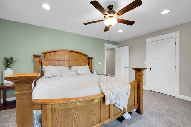 bedroom featuring recessed lighting, light colored carpet, ceiling fan, and baseboards