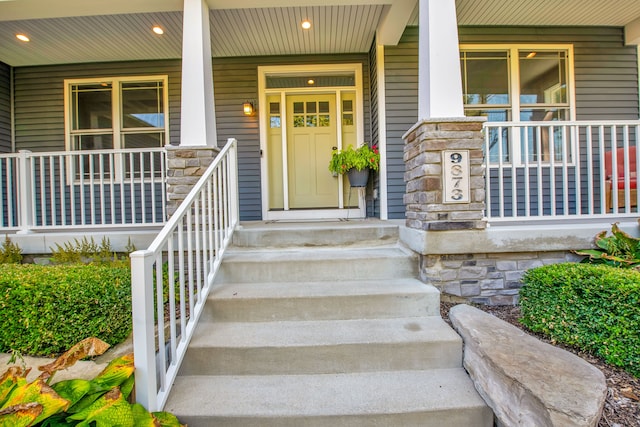 entrance to property featuring a porch