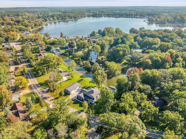 aerial view featuring a water view and a view of trees