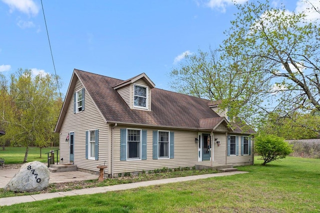 8770 W E Rd, Lakeside, MI 49128 - view of front of property with a front lawn and a shingled roof