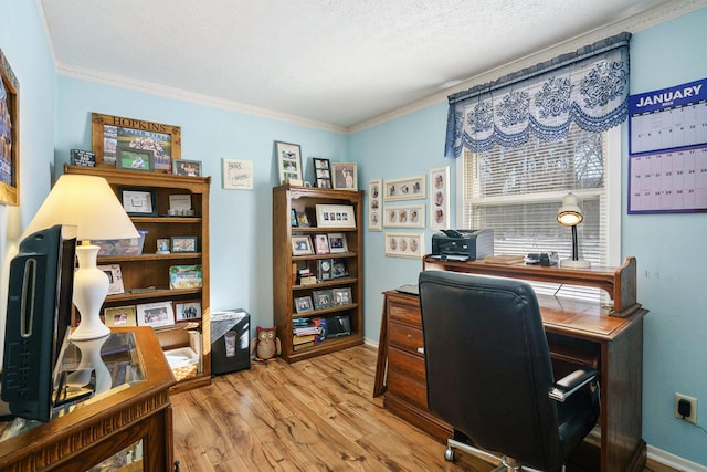 home office with baseboards, crown molding, a textured ceiling, and light wood finished floors