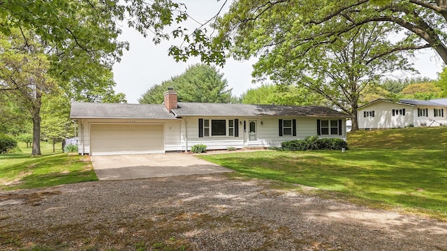 54348 Twin Lakes Rd, Dowagiac, MI 49047 - ranch-style home with an attached garage, concrete driveway, a chimney, a front lawn, and a shingled roof