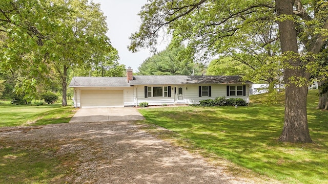 54348 Twin Lakes Rd, Dowagiac, MI 49047 - single story home with concrete driveway, a garage, a front lawn, and a chimney