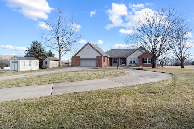 view of front facade featuring brick siding, an attached garage, a front yard, a shed, and driveway