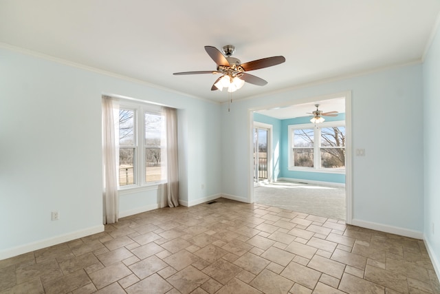 unfurnished room with baseboards, ornamental molding, and a ceiling fan