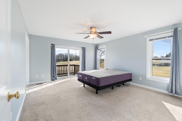 bedroom featuring baseboards, carpet floors, ceiling fan, and access to exterior