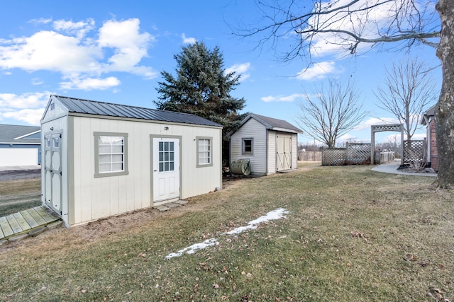 view of shed featuring fence