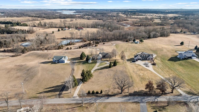 birds eye view of property with a rural view