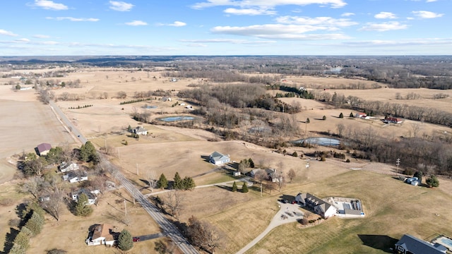 birds eye view of property with a rural view