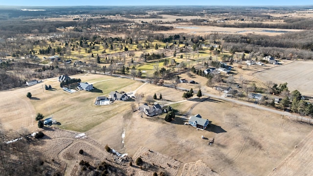 birds eye view of property with a rural view