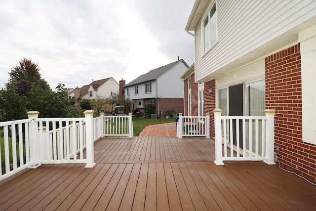 wooden terrace with a residential view