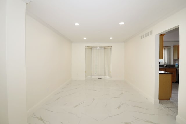 spare room with marble finish floor, baseboards, visible vents, and recessed lighting