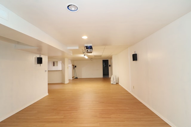 empty room featuring light wood-style floors, baseboards, and recessed lighting