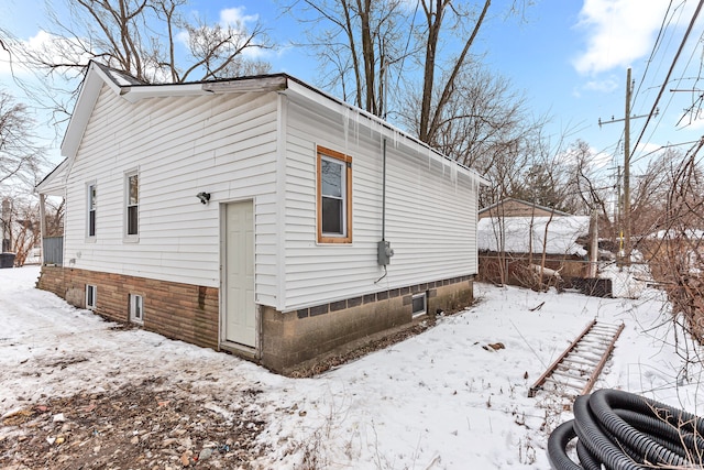 view of snow covered property