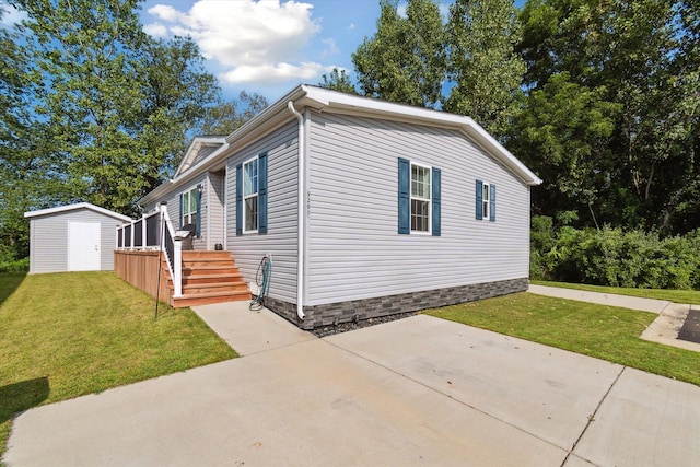 view of property exterior featuring an outbuilding, a patio area, a yard, and a storage shed