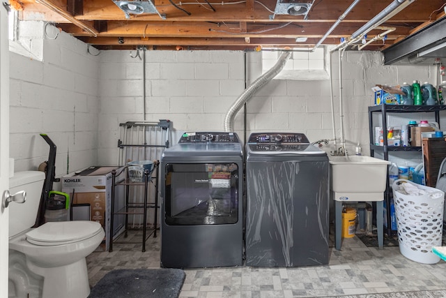 laundry room with laundry area, tile patterned floors, and independent washer and dryer