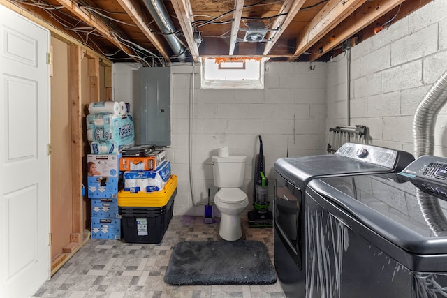 washroom with laundry area, washer and clothes dryer, and electric panel