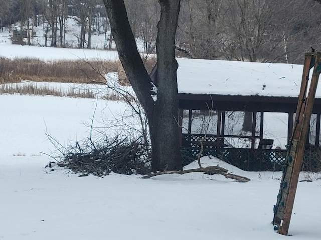 view of yard layered in snow