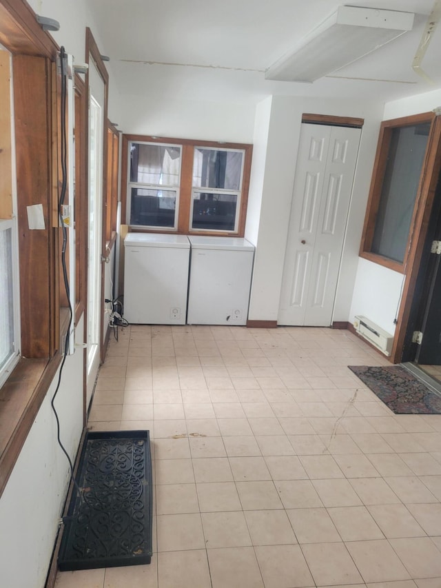 laundry room featuring baseboard heating