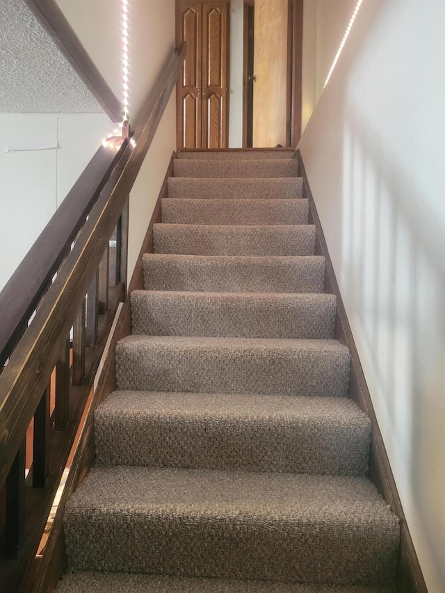 stairway with carpet flooring