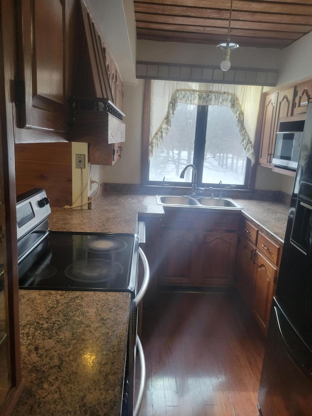 kitchen with dark wood-style floors, range hood, a sink, wood ceiling, and appliances with stainless steel finishes