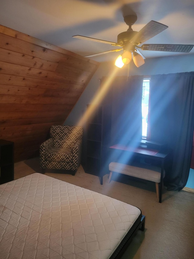 bedroom with a ceiling fan, lofted ceiling, and carpet flooring