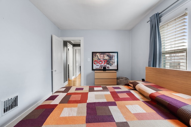 unfurnished bedroom featuring visible vents and baseboards