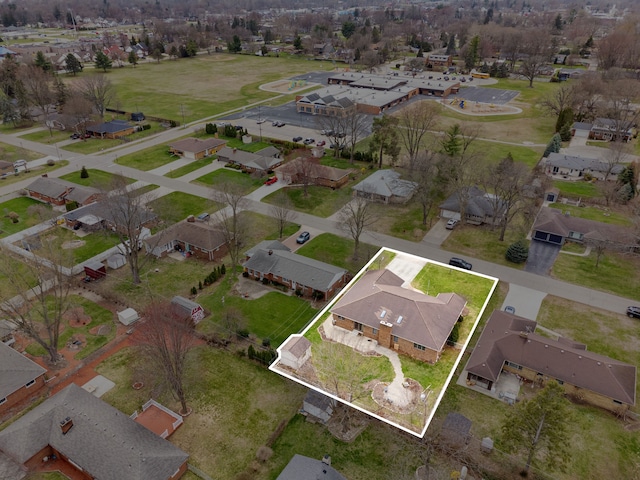 birds eye view of property with a residential view