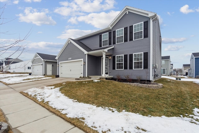 view of front of house with a garage, concrete driveway, and a lawn