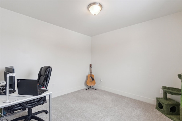 office area with light carpet and baseboards